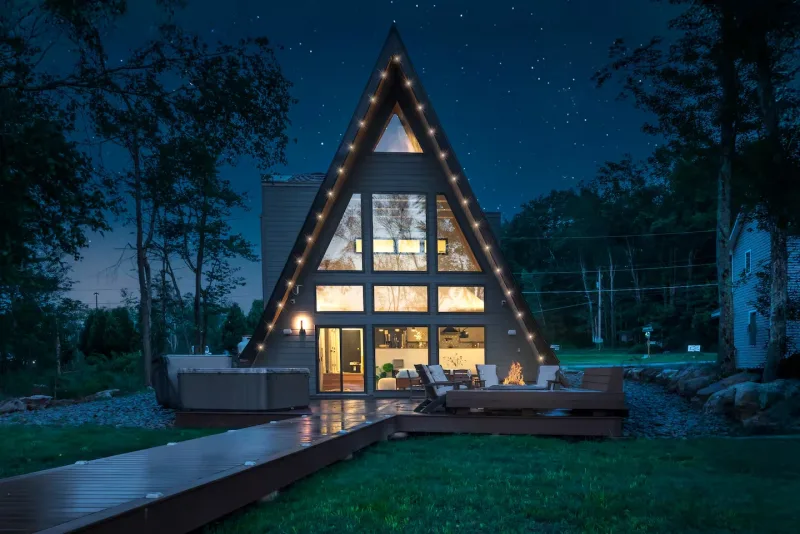 Moonlit Peak — modern A-frame cabin lit up under a starry sky, Tobyhanna Twp PA
