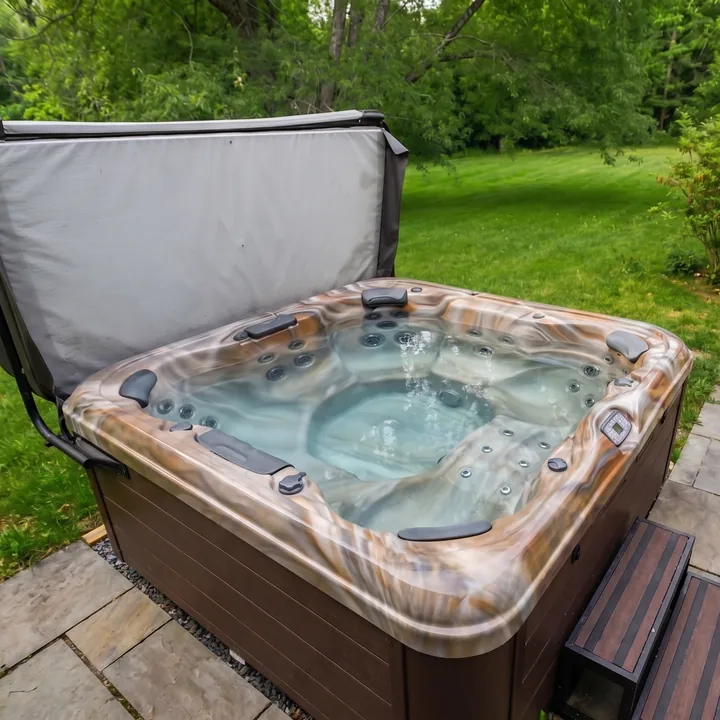 Hot tub with cover open on the stone patio