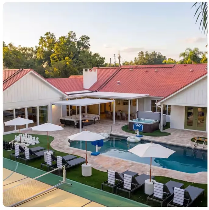 Aerial of the villa, pool and sport courts