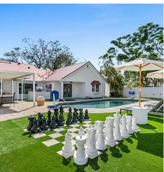 Backyard with giant chess and putting green
