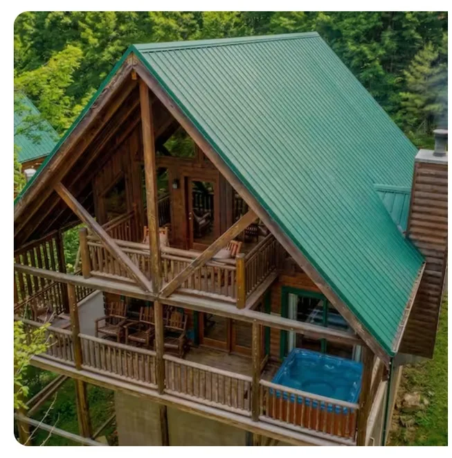 Cabin exterior with green metal roof