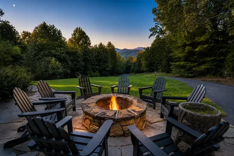 Fire pit circle with Blue Ridge mountain view at dusk