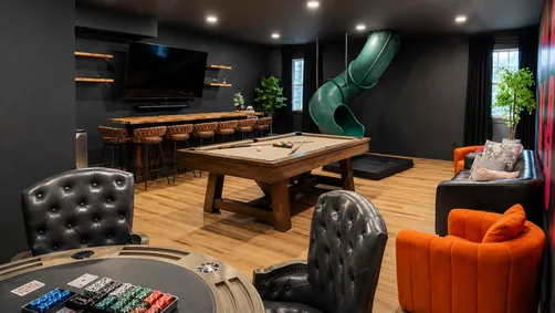 Game room with slide, pool table and bar