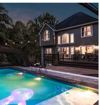House and pool lit at dusk