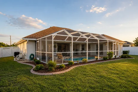 Backyard and screened pool enclosure