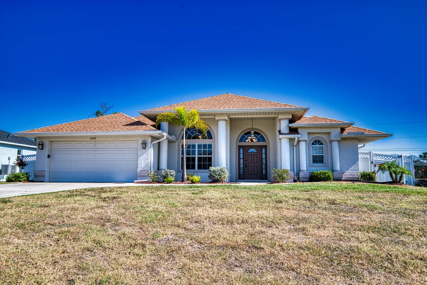 Front exterior with dried-out lawn