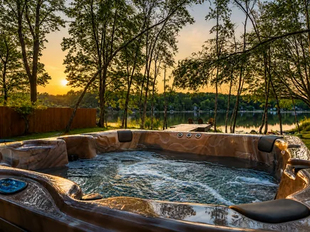 Hot tub overlooking the lake at sunset