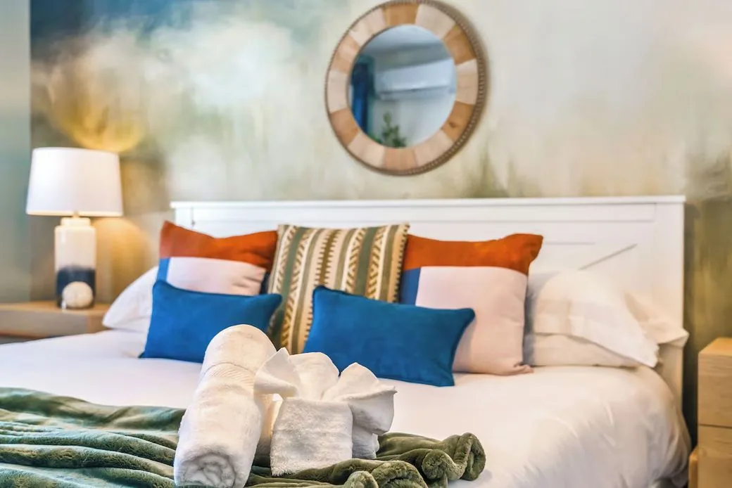 Bedroom with blue accent pillows